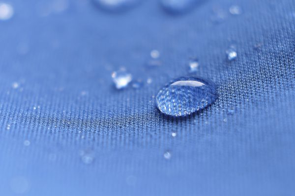 water beading on waxed canvas, water resistant fabric, water repellant fabric